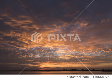 Tropical sea beach in summer time on sunny day. Golden sand beach sea peaceful scenery on the beach. Travel vacation seaside outdoor. Ocean island beautiful dramatic landscape. Sunny seascape scene. 110668976
