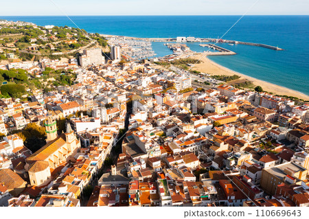 Drone view of coastal town of Arenys de Mar with church, Spain Drone view of coastal town of Arenys de Mar with church, Spain 110669643