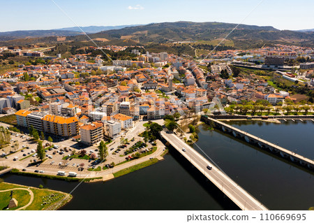 Aerial view of Mirandela city with bridges crossing Tua river, Portugal Aerial view of Mirandela city with bridges crossing Tua river, Portugal 110669695