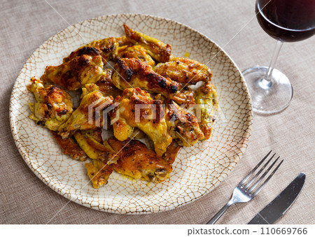 Service plate containing delicious fried chicken wings with necessary table laying closeup 110669766