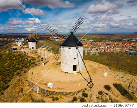 Aerial view of Route of Don Quixote with windmills in Consuegra Aerial view of Route of Don Quixote with windmills in Consuegra 110669777