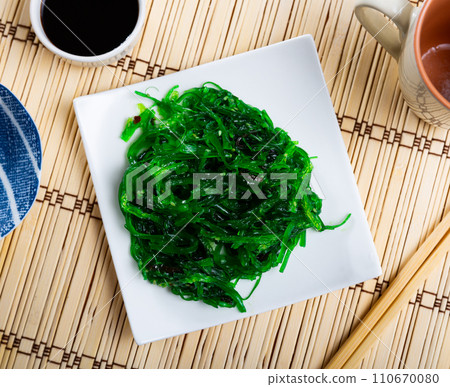 Goma Wakame salad served in a plate with soy sauce 110670080