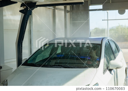 Process of car washing with driver inside Process of car washing with driver inside 110670083