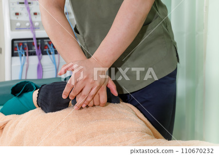 Foot massage, patient receiving treatment and hands of judo therapist Foot massage, patient receiving treatment and hands of judo therapist 110670232