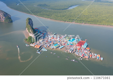 Aerial view of Koh Panyee, The Floating village urban city town houses, lake sea or river. Nature landscape fisheries and fishing tools at Pak Pha, Phang Nga, Thailand. Aquaculture farming 110671081
