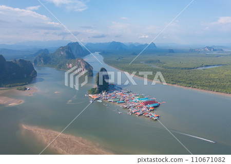 Aerial view of Koh Panyee, The Floating village urban city town houses, lake sea or river. Nature landscape fisheries and fishing tools at Pak Pha, Phang Nga, Thailand. Aquaculture farming 110671082