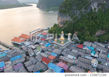 Aerial view of Koh Panyee, The Floating village urban city town houses, lake sea or river. Nature landscape fisheries and fishing tools at Pak Pha, Phang Nga, Thailand. Aquaculture farming 110671100