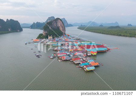 Aerial view of Koh Panyee, The Floating village urban city town houses, lake sea or river. Nature landscape fisheries and fishing tools at Pak Pha, Phang Nga, Thailand. Aquaculture farming 110671107
