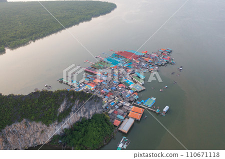 Aerial view of Koh Panyee, The Floating village urban city town houses, lake sea or river. Nature landscape fisheries and fishing tools at Pak Pha, Phang Nga, Thailand. Aquaculture farming 110671118