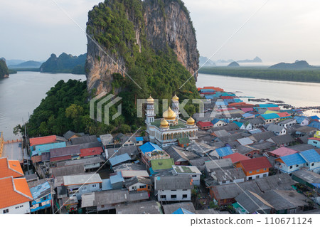 Aerial view of Koh Panyee, The Floating village urban city town houses, lake sea or river. Nature landscape fisheries and fishing tools at Pak Pha, Phang Nga, Thailand. Aquaculture farming 110671124
