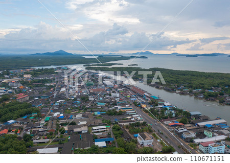 Aerial view of Ranong City, The Floating village urban city town houses, lake sea or river. Nature landscape fisheries and fishing tools, Thailand. Aquaculture farming Aerial view of Ranong City, The Floating village urban city town houses, lake sea or river. Nature landscape fisheries and fishing tools, Thailand. Aquaculture farming 110671151