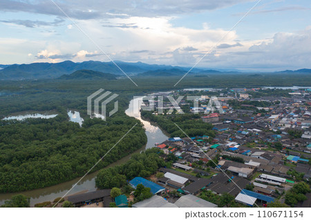 Aerial view of Ranong City, The Floating village urban city town houses, lake sea or river. Nature landscape fisheries and fishing tools, Thailand. Aquaculture farming Aerial view of Ranong City, The Floating village urban city town houses, lake sea or river. Nature landscape fisheries and fishing tools, Thailand. Aquaculture farming 110671154