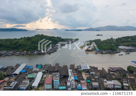 Aerial view of Ranong City, The Floating village urban city town houses, lake sea or river. Nature landscape fisheries and fishing tools, Thailand. Aquaculture farming Aerial view of Ranong City, The Floating village urban city town houses, lake sea or river. Nature landscape fisheries and fishing tools, Thailand. Aquaculture farming 110671155
