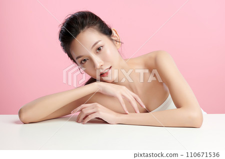 Beautiful young asian woman with clean fresh skin on pink background, Face care, Facial treatment, Cosmetology, beauty and spa, Asian women portrait. Beautiful young asian woman with clean fresh skin on pink background, Face care, Facial treatment, Cosmetology, beauty and spa, Asian women portrait. 110671536