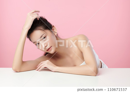 Beautiful young asian woman with clean fresh skin on pink background, Face care, Facial treatment, Cosmetology, beauty and spa, Asian women portrait. 110671537