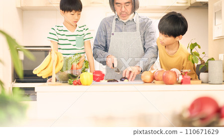 father and son cooking in the kitchen 110671629