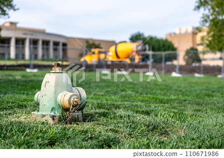 Sunken low level dry barrel fire hydrant in an open grassed area Sunken low level dry barrel fire hydrant in an open grassed area 110671986