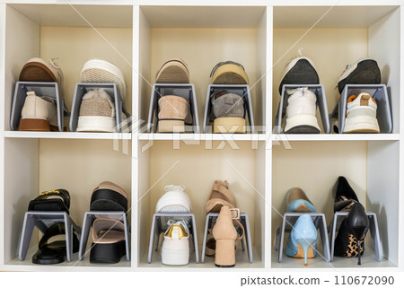 Shoes contemporary storage at home cupboard with shelves cozy room with potted plant interior Shoes contemporary storage at home cupboard with shelves cozy room with potted plant interior 110672090