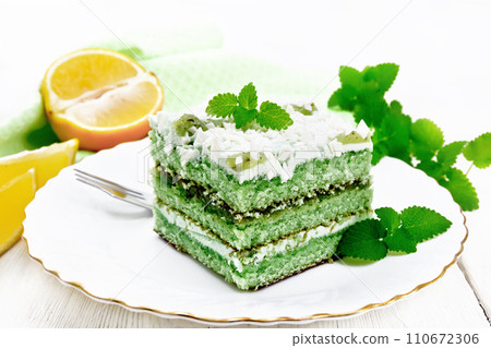 Cake with orange and mint in plate on table 110672306