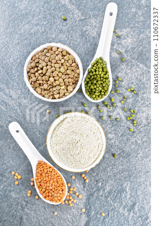 Flour lentil in bowl on stone table top Flour lentil in bowl on stone table top 110672337