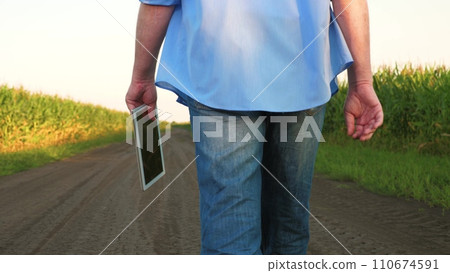 man farmer works field with digital tablet, agriculture, business concept agriculture, farmer with tablet works corn field, controls harvesting process, technology agriculture, growing corn business, 110674591