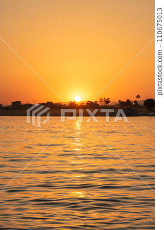 Beautiful sunset scenery on the Nile River in Egypt Beautiful sunset scenery on the Nile River in Egypt 110675013