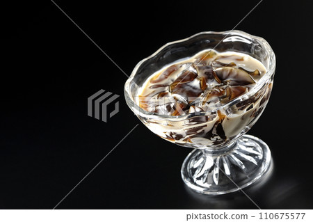 Coffee jelly photographed against a black background Coffee jelly photographed against a black background 110675577