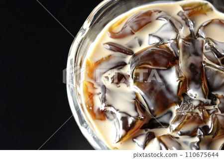Overhead shot of coffee jelly against a black background Overhead shot of coffee jelly against a black background 110675644
