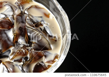 Overhead shot of coffee jelly against a black background Overhead shot of coffee jelly against a black background 110675645