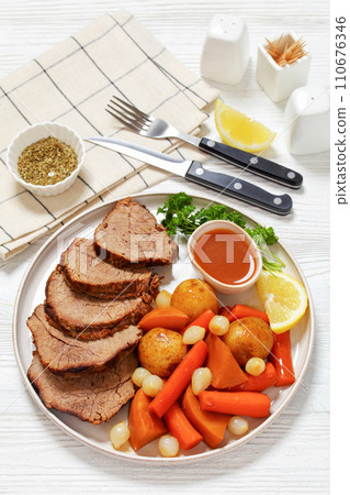 roast beef with dipping sauce and winter veggies roast beef with dipping sauce and winter veggies 110676346