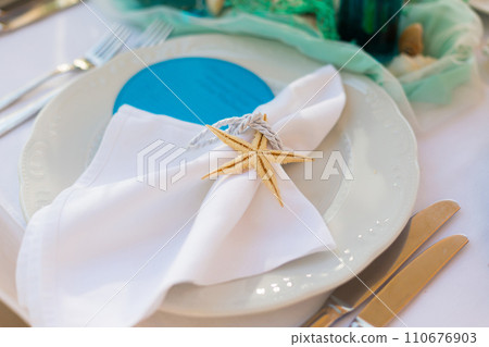 decorated table in the restaurant for a wedding dinner decorated table in the restaurant for a wedding dinner 110676903