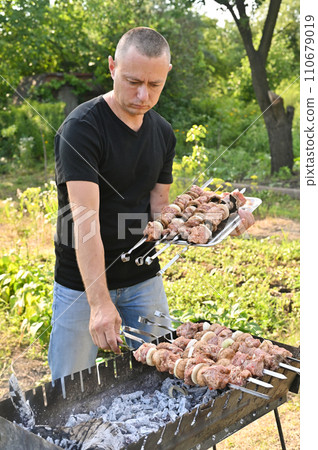 cooking a barbecue from pork meat on the grill cooking a barbecue from pork meat on the grill 110679019