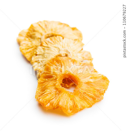 Dried pineapple rings isolated on white background. 110679227
