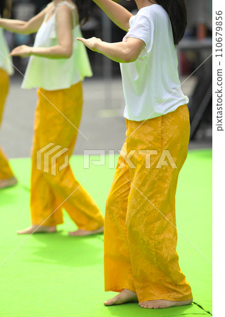 Women doing hula dancing Women doing hula dancing 110679856