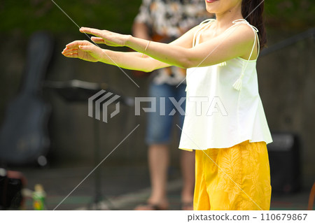 Women doing hula dancing Women doing hula dancing 110679867