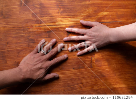 The hands of men and women who used wedding rings The hands of men and women who used wedding rings 110681294