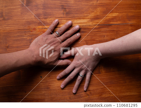 The hands of men and women who used wedding rings The hands of men and women who used wedding rings 110681295