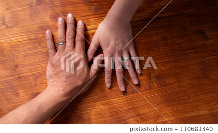 The hands of men and women who used wedding rings The hands of men and women who used wedding rings 110681340