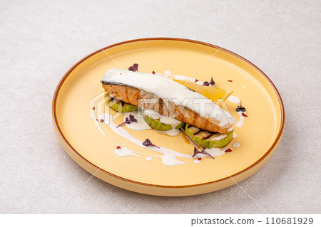 Portion of gourmet salmon steak on zucchini Portion of gourmet salmon steak on zucchini 110681929