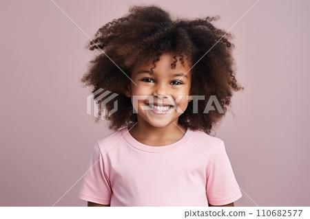 Portrait of a smiling african american little girl over pink background. 110682577