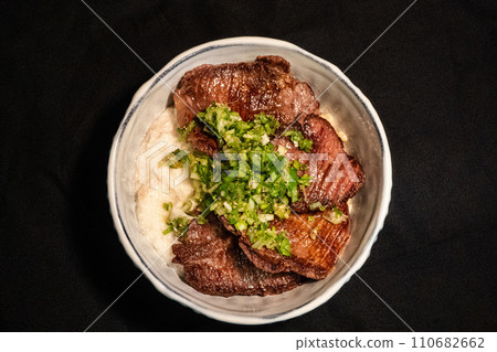 Beef tongue bowl on black background Beef tongue bowl on black background 110682662