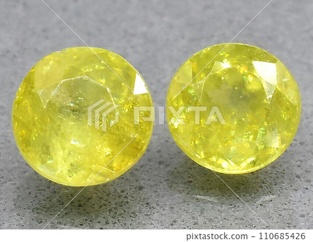 natural yellow sphene gem on the background 110685426