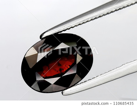 natural garnet spessartite gem on the background 110685435