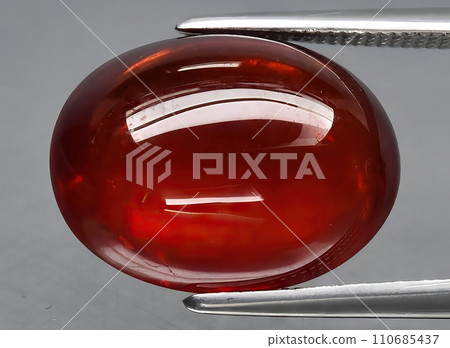 natural garnet spessartite gem on the background natural garnet spessartite gem on the background 110685437