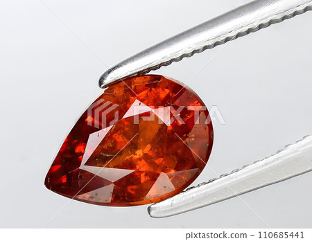 natural garnet spessartite gem on the background 110685441