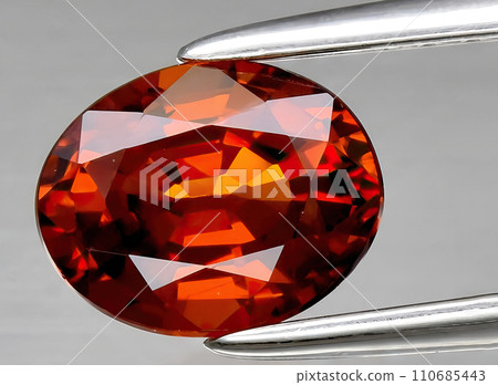 natural garnet spessartite gem on the background natural garnet spessartite gem on the background 110685443