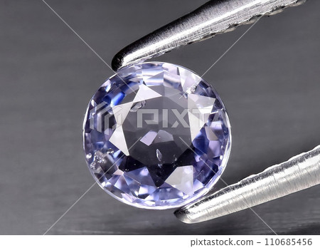 natural blue purple sapphire gem on the background 110685456