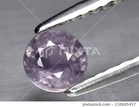 natural blue purple sapphire gem on the background 110685457