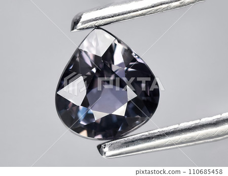 natural blue purple sapphire gem on the background natural blue purple sapphire gem on the background 110685458