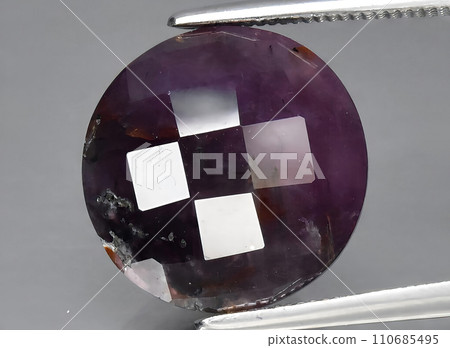 natural purple sapphire gem on the background 110685495